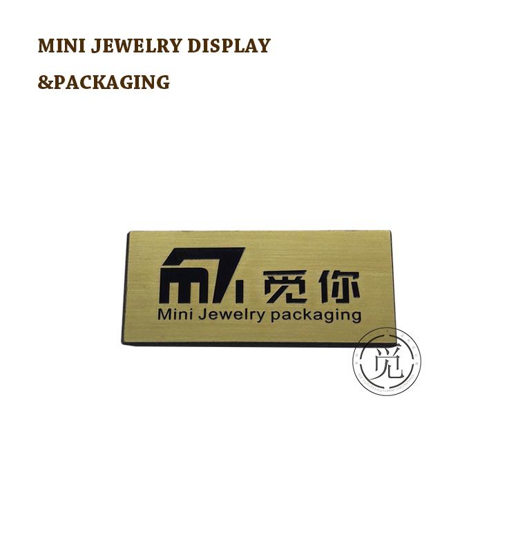 Gold electroplate brushed stainless steel logo